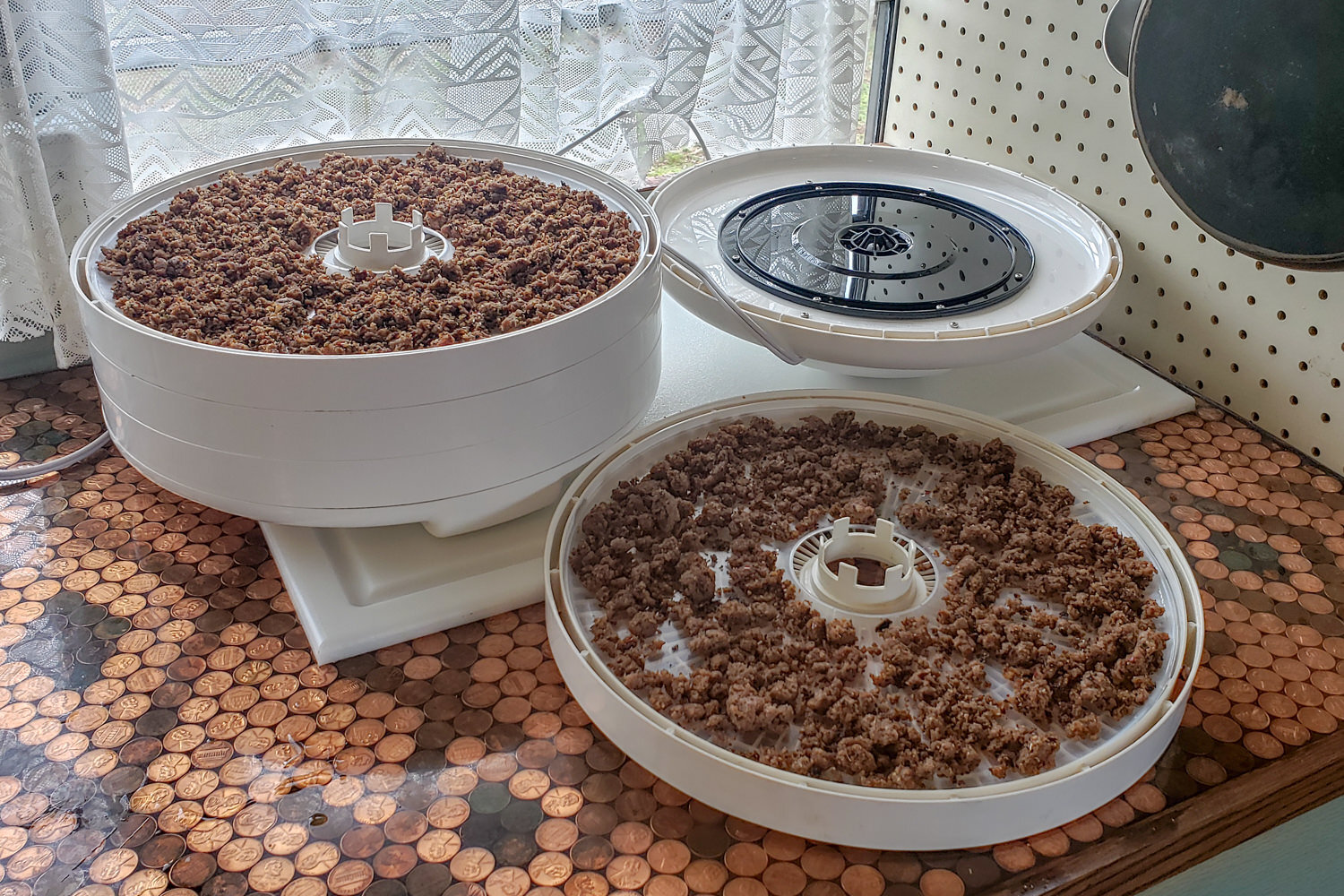 trays of meat dehydrating
