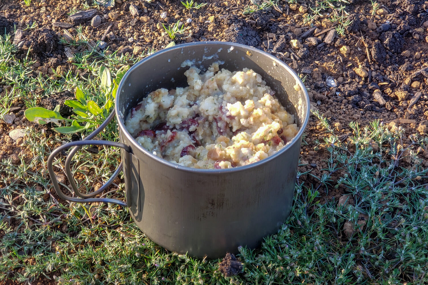 backpacking meal in a backpacking pot on the ground