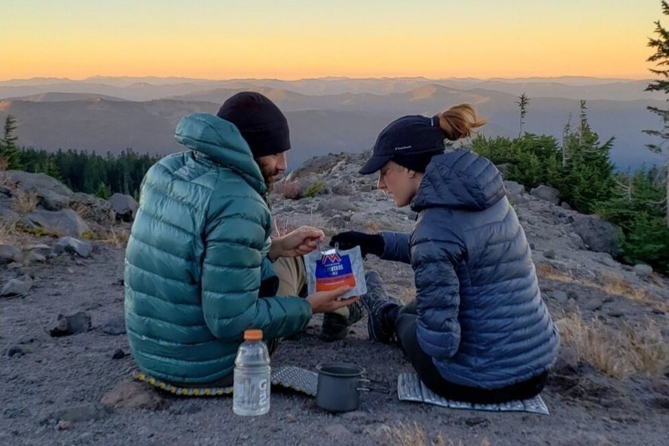 Backpackers-sharing-a-Mountain-House-breakfast-at-sunrise