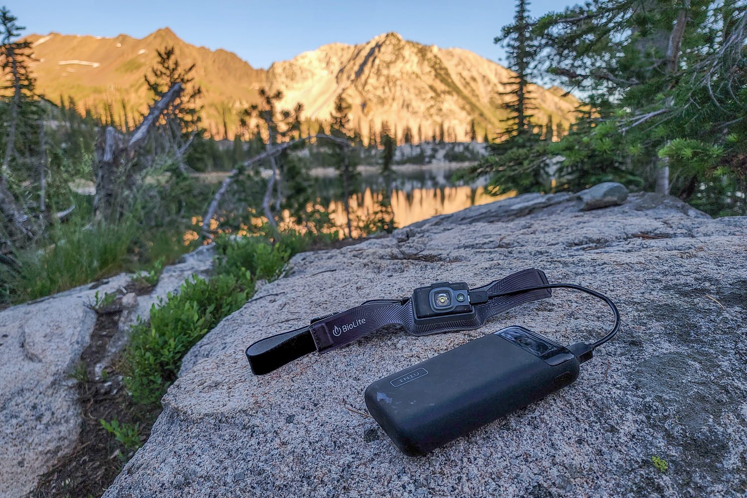 a headlamp charging from a portable battery pack in the wallowas