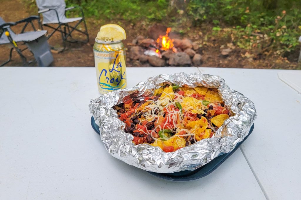 cooked nachos in a foil packet on a table
