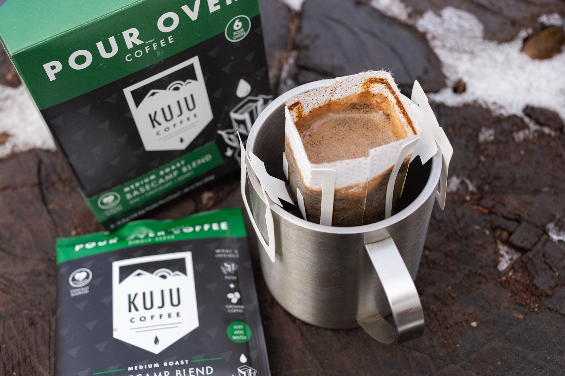 A Kuju coffee pouch sits in a mug.