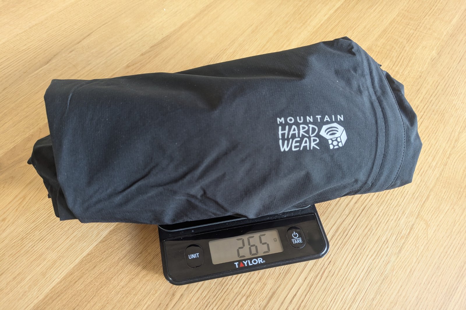 Weighing the Mountain Hardware Stretch Ozonic pants on a small kitchen scale.