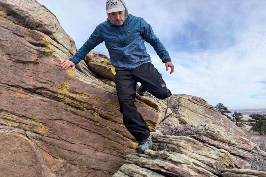 Scrambling on some rock in the Mountain Hardware Stretch Ozonic rain pants.