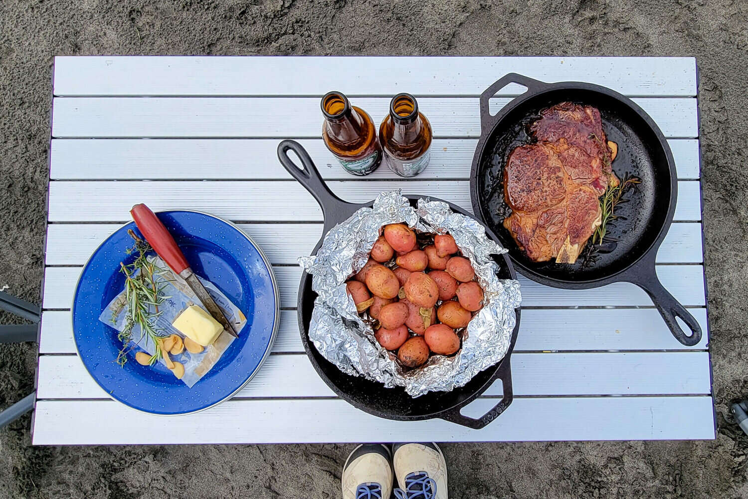 a meal sitting on a camp table using the Lodge Cast Iron Combo Cooker